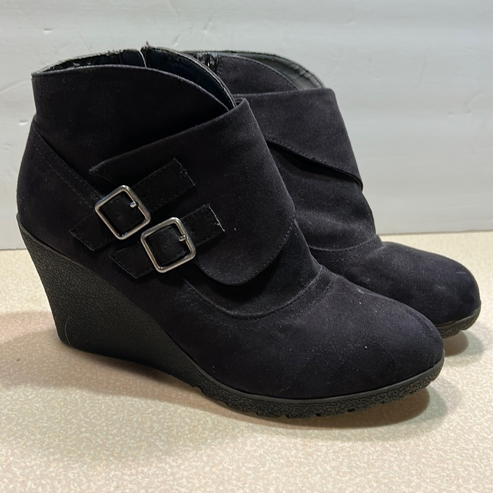 Black side zip booties by METAPHOR